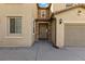 Front entrance with stone accents, covered porch and nearby two car garage at 6909 Forest Gate St, North Las Vegas, NV 89084