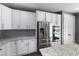 Bright kitchen featuring white cabinetry, stainless steel appliances, and granite countertops at 6909 Forest Gate St, North Las Vegas, NV 89084
