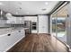 Modern kitchen with stainless steel appliances and a sliding door to the backyard at 6909 Forest Gate St, North Las Vegas, NV 89084