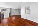 Spacious living room with hardwood floors, lots of natural light, and ceiling fan at 6909 Forest Gate St, North Las Vegas, NV 89084