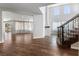 Bright living room with fireplace, staircase, hardwood floors, and lots of natural light at 6909 Forest Gate St, North Las Vegas, NV 89084