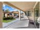 This covered patio is perfect for outdoor entertaining with views of the backyard and outdoor kitchen at 6909 Forest Gate St, North Las Vegas, NV 89084
