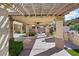 Covered patio area offering shade for outdoor entertainment, complete with an outdoor kitchen and bar at 6909 Forest Gate St, North Las Vegas, NV 89084