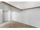 Walk-in closet with white walls, shelving and carpeted flooring provides functional storage space at 6909 Forest Gate St, North Las Vegas, NV 89084