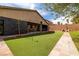 Spacious backyard featuring artificial turf, desert landscaping and outdoor seating at 7180 White Bloom Ave, Las Vegas, NV 89117