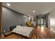 Bright bedroom with hardwood floors, slider to yard, and a modern design at 7180 White Bloom Ave, Las Vegas, NV 89117