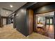 Hallway to the bedroom with wood flooring and access to kitchen and bathroom at 7180 White Bloom Ave, Las Vegas, NV 89117