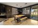 Charming dining area with a wooden table, ample seating, and sliding doors for easy outdoor access at 7180 White Bloom Ave, Las Vegas, NV 89117