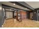 Welcoming foyer features tile flooring, decorative wood slat wall, and double-door entryway for a grand entrance at 7180 White Bloom Ave, Las Vegas, NV 89117