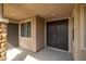 Covered front entry featuring a double front door, stone pillar, and recessed lighting at 7180 White Bloom Ave, Las Vegas, NV 89117