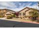 Charming single-story home with desert landscaping, an attached garage and a tiled roof at 7180 White Bloom Ave, Las Vegas, NV 89117