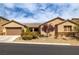 Attractive single-story home with a low-maintenance desert landscape and two car garage at 7180 White Bloom Ave, Las Vegas, NV 89117