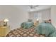 Cozy bedroom with two twin beds, vintage nightstands, and decorative pillows at 7405 Blue Sage Ct, Las Vegas, NV 89129