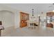 Dining room features a stylish light fixture and flows into the living spaces at 7405 Blue Sage Ct, Las Vegas, NV 89129