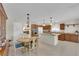 Large eat-in kitchen with a fireplace, granite countertops, stainless steel appliances, and tile flooring at 7405 Blue Sage Ct, Las Vegas, NV 89129