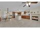 Large eat-in kitchen with a fireplace, granite countertops, stainless steel appliances, and tile flooring at 7405 Blue Sage Ct, Las Vegas, NV 89129