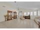 Expansive living room boasts neutral walls, tile flooring, classic furnishings, and bright natural light at 7405 Blue Sage Ct, Las Vegas, NV 89129