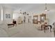 Bright and spacious living room featuring tile flooring, high ceilings and classic furnishings at 7405 Blue Sage Ct, Las Vegas, NV 89129