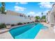 Spacious backyard with a sparkling pool and ample space, ideal for summer fun at 7405 Blue Sage Ct, Las Vegas, NV 89129