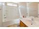 This is a bathroom featuring a shower-tub combo, white cabinets, and tile floors at 7826 Shingle Beach St, Las Vegas, NV 89166