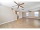 Bright and airy living space with wood-look flooring and a staircase at 7826 Shingle Beach St, Las Vegas, NV 89166