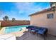 Inviting backyard oasis with sparkling pool, patio seating, and a private setting at 792 Valley Rise Dr, Henderson, NV 89052