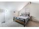 Bedroom boasts vaulted ceilings, plush carpet, and a comfortable bed with a modern design at 792 Valley Rise Dr, Henderson, NV 89052