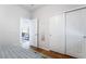 Bedroom features a closet with sliding doors and an open doorway, hardwood floors, and neutral paint at 792 Valley Rise Dr, Henderson, NV 89052