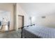 Bedroom with sloped ceiling, plush carpet, and a modern bed design at 792 Valley Rise Dr, Henderson, NV 89052