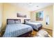 Bright bedroom with two twin beds, wood floors, and large window with a view at 792 Valley Rise Dr, Henderson, NV 89052