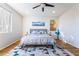Comfortable bedroom offers a large bed with hardwood floors and a decorative rug at 792 Valley Rise Dr, Henderson, NV 89052
