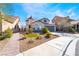 Beautiful one story home with manicured desert landscaping, charming exterior details, and a welcoming facade at 792 Valley Rise Dr, Henderson, NV 89052