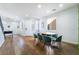 Open-concept living space with hardwood floors, modern decor, and a dining area, perfect for entertaining at 792 Valley Rise Dr, Henderson, NV 89052