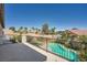 This backyard has a pool, palm trees, and beautiful desert landscaping at 8228 Fritzen Ave, Las Vegas, NV 89131