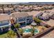 Aerial view of a home's backyard featuring a pool, patio, and well-maintained landscaping at 8228 Fritzen Ave, Las Vegas, NV 89131