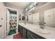 This full bathroom has double sinks with lots of countertop space, a toilet, and a shower at 8228 Fritzen Ave, Las Vegas, NV 89131