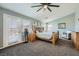 Bright bedroom with a wooden bed frame, natural light, and neutral color scheme, providing a serene and inviting atmosphere at 8228 Fritzen Ave, Las Vegas, NV 89131