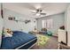 This bedroom has carpet, ceiling fan, and natural light from the window at 8228 Fritzen Ave, Las Vegas, NV 89131