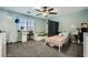 This comfortable bedroom has a desk, 2 beds, neutral walls and carpet at 8228 Fritzen Ave, Las Vegas, NV 89131