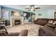 Relaxing living room with a cozy fireplace and mantel, creating a warm and inviting atmosphere for Gathering and friends at 8228 Fritzen Ave, Las Vegas, NV 89131