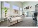 Spacious living room with high ceilings, lots of natural light, and a comfortable sectional sofa at 8228 Fritzen Ave, Las Vegas, NV 89131
