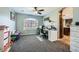 Bright home office with a work station, an arched window and view to the rest of the home at 8228 Fritzen Ave, Las Vegas, NV 89131