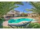 Inviting backyard pool with a hammock and a patio area perfect for outdoor relaxation and entertainment at 8228 Fritzen Ave, Las Vegas, NV 89131
