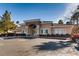 Community clubhouse exterior with ample parking, desert landscaping and decorative stone accents at 830 Carnegie St # 724, Henderson, NV 89052