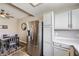 Modern dining area featuring a stainless refrigerator, dining table set, and stylish decorations creating a welcoming ambiance at 830 Carnegie St # 724, Henderson, NV 89052