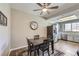 Cozy dining area featuring a ceiling fan, stainless refrigerator, and a charming wall clock above the table at 830 Carnegie St # 724, Henderson, NV 89052
