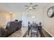 Bright dining area featuring ceiling fan, table set for four, and open access to living room at 830 Carnegie St # 724, Henderson, NV 89052