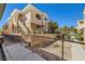 Charming condo complex showcasing stairs leading to upper-level units and well-maintained landscaping at 830 Carnegie St # 724, Henderson, NV 89052