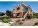 Beautiful two-story condo featuring landscaped front yard, stairs, and stylish architectural details at 830 Carnegie St # 724, Henderson, NV 89052