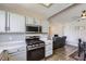 Spacious kitchen offering stainless appliances, sleek countertops, and a clear view into the adjacent living area at 830 Carnegie St # 724, Henderson, NV 89052